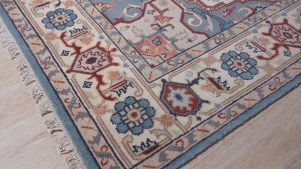 Ivory medallion rug corner and border detail