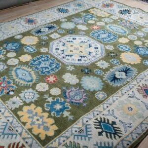 Light green beige Kazak hand-knotted rug, angled full view