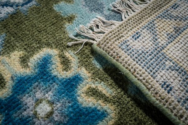 Light green beige kazak rug hand-knotted back and fringe detail