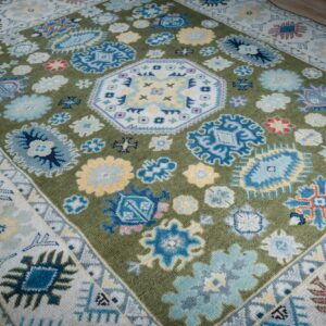 Light green beige Kazak rug angled field detail