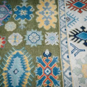 Light green beige Kazak rug field and border detail