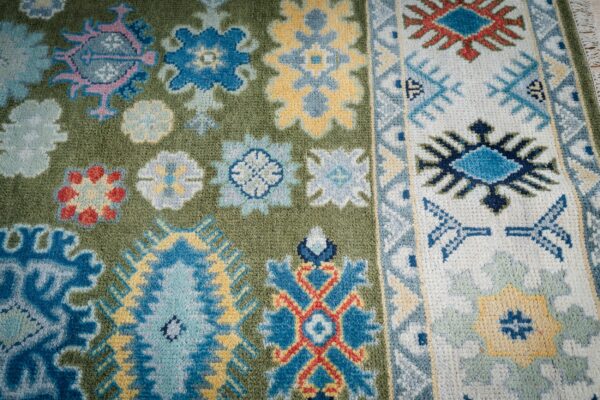 Light green beige kazak rug field and border detail