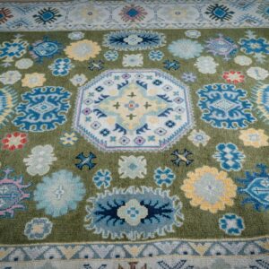 Light green beige Kazak rug field and medallion detail