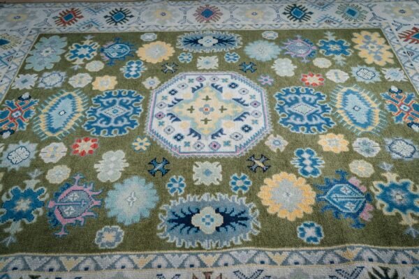 Light green beige kazak rug field and medallion detail