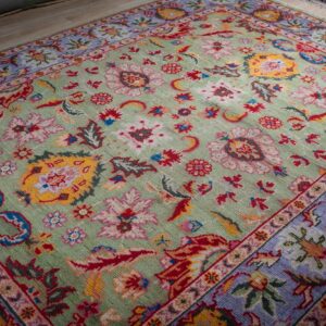 Light green Oushak rug angled full view