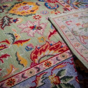 Light green Oushak rug back corner detail