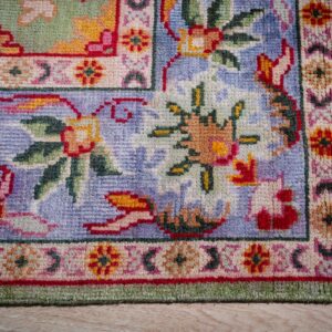 Light green Oushak rug corner and periwinkle border detail