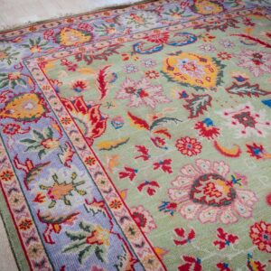 Light green Oushak rug field and border detail