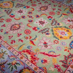 Light green Oushak rug floral field close-up