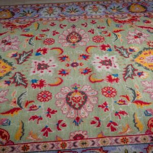 Light green Oushak rug top-down field detail