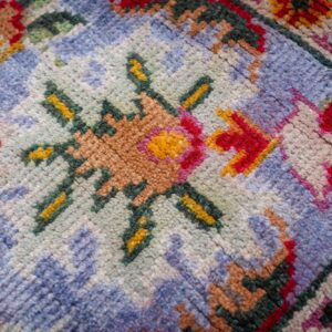 Light green Oushak rug floral motif close-up
