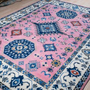 Pink ivory Kazak rug angled full view