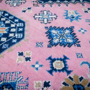 Pink ivory Kazak rug field close-up