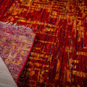 Sari-silk red abstract Anand rug corner folded showing the back