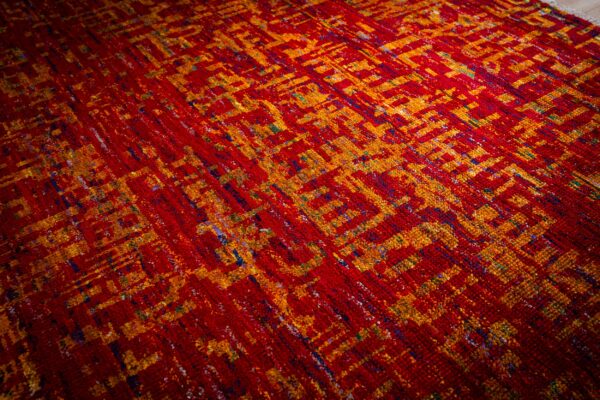 Sari-silk red abstract anand rug angled field detail