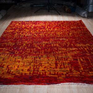 Hand-knotted sari-silk red abstract Anand rug, full view on the floor