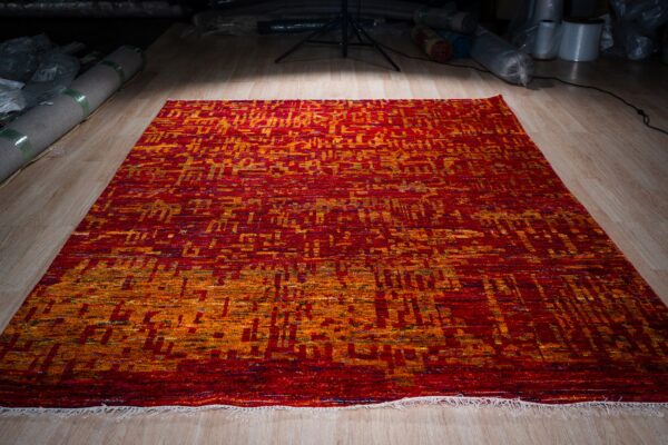 Hand-knotted sari-silk red abstract anand rug, full view on the floor