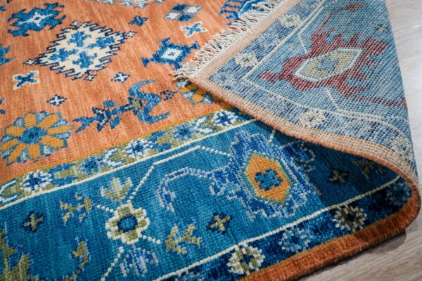 Rust blue kazak rug back and border detail