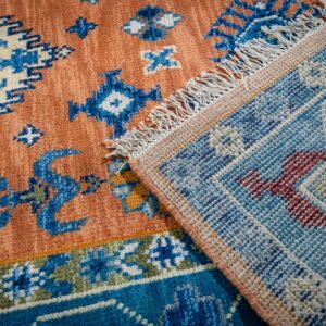 Rust blue Kazak rug hand-knotted back and fringe detail