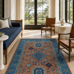 Rust blue Kazak rug styled in a sunroom