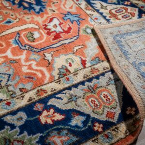 Rust Oushak rug back and navy border detail