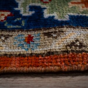 Rust Oushak rug edge and pile detail