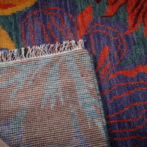 Teal contemporary floral rug hand-knotted back detail