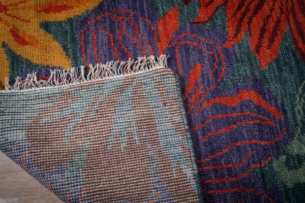 Teal contemporary floral rug hand-knotted back detail