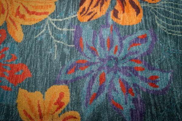 Teal contemporary floral rug blossom motif close-up