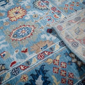 Turquoise Oushak rug field and hand-knotted back detail