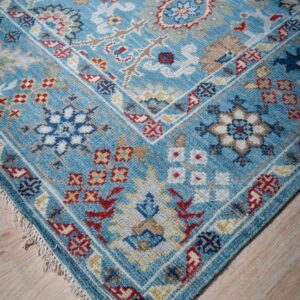 Turquoise Oushak rug corner and border detail