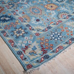 Turquoise Oushak rug corner and fringe detail