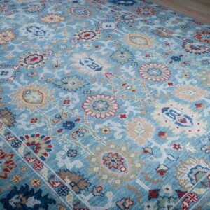 Turquoise Oushak rug angled field detail