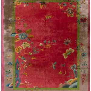 Antique 1920s Chinese Art Deco rug with a raspberry-red field, taupe border and green inner frame, floral sprays and blue rockwork at the corners