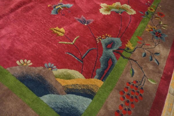 Antique red color classic chinese art deco design room size carpet 10 Border detail of a red chinese art deco rug showing blue, teal and olive rockwork mounds and a red berry cluster