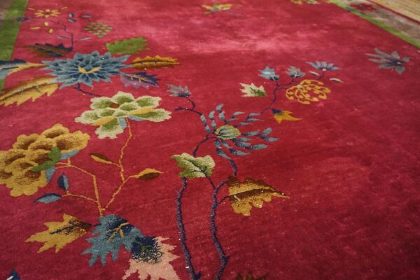 Antique red color classic chinese art deco design room size carpet 13 Close detail of the deep red field of a chinese art deco rug with gold and olive peonies and teal foliage