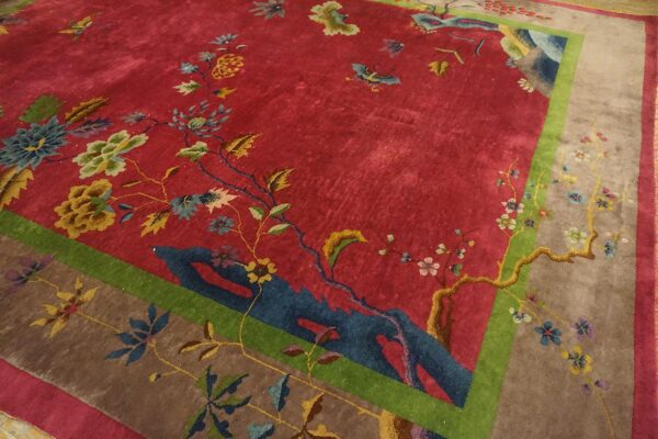 Antique red color classic chinese art deco design room size carpet 8 Angled corner of a red 1920s chinese art deco carpet on a wood floor, with blue rockwork and gold and cream peonies