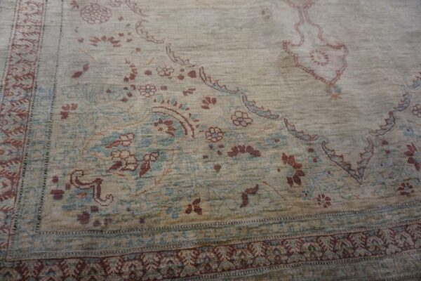 Elegant intricate ivory background color in a medallion pattern antique persian tabriz rug - detail view 2