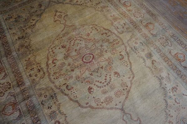 Elegant intricate ivory background color in a medallion pattern antique persian tabriz rug - detail view 4
