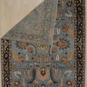 Close-up detail of the gray and navy traditional all-over pattern on the hand-knotted wool rug KR110GY
