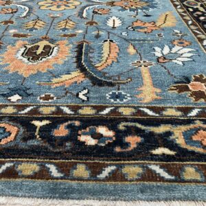 Corner detail of the KR110GY gray navy hand-knotted wool rug showing pile and border