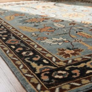Gray and navy traditional hand-knotted wool rug KR110GY displayed in a room scene