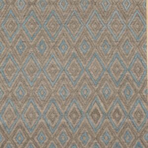 Gray transitional trellis handmade wool and viscose area rug styled in a living room