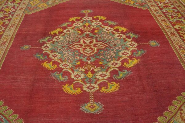 Spellbinding red-raspebery fiedl with delicate medallion pattern antique turkish ghiordes oushak rug 3 Spellbinding red-raspebery fiedl with delicate medallion pattern antique turkish ghiordes oushak rug - detail view 2