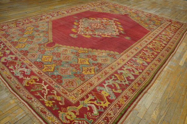 Spellbinding red-raspebery fiedl with delicate medallion pattern antique turkish ghiordes oushak rug 8 Spellbinding red-raspebery fiedl with delicate medallion pattern antique turkish ghiordes oushak rug - detail view 7