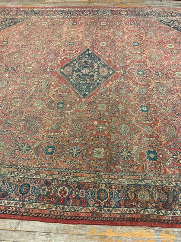 1890s red field medallion large scale antique sultanabad knotted wool rug 3 1890s red field medallion large scale antique sultanabad knotted wool rug - detail view 2