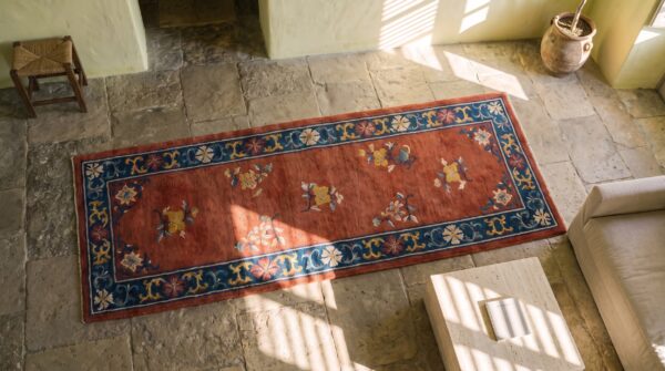 Antique 1920s chinese art deco allover floral coral hand knotted hallway runner rug (sku 22414) - styled overhead view
