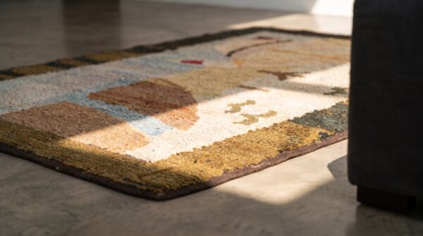 1920s small scatter size american ivory hooked antique wool rug (sku 19799) - in-room detail