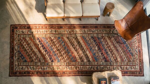 Antique 19th century tribal kurdish hallway runner rug 2 Antique 19th century tribal kurdish hallway runner rug (sku 21893) - styled overhead view