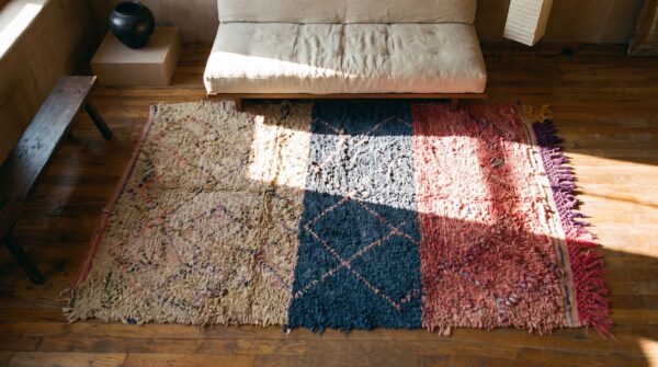 Allover geometric hand knotted pile wool 1940s multicolor jewel tones boucherouitte antique rug (sku 22447) - styled overhead view